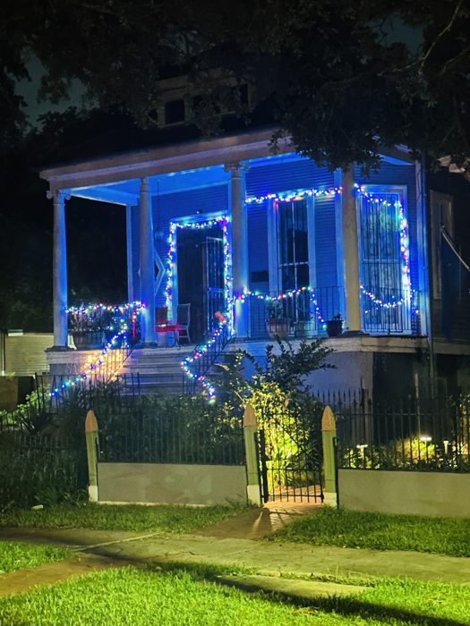 Bloody Mary's Haunted Museum lit up electric blue after dark.