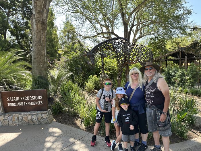 The whole crew lined up on a shady Safari Park path mid-adventure.
