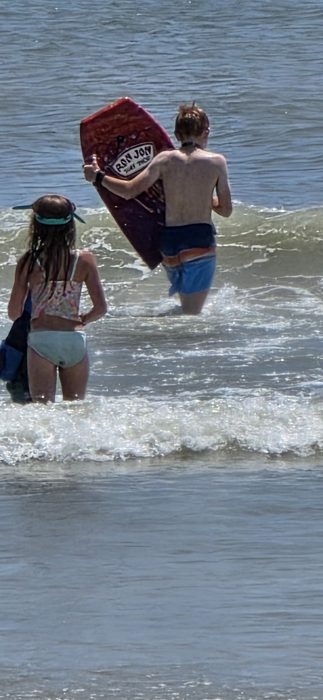 Heading out to catch some waves with the Ron Jon boogie board.