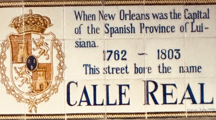The historic Calle Real plaque marking the old Spanish name of the street.