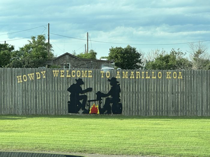 The cheerful 'Howdy Welcome to Amarillo KOA' sign greeting us at the gate.