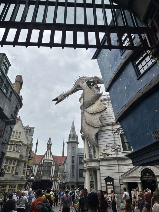 Gringotts' dragon rises above the rooftops of Diagon Alley.