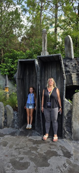 One of the kids and a family member step into the coffin photo op, looking suitably spooked.