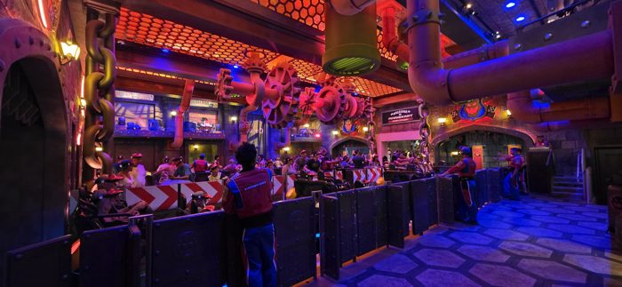Deeper into the neon-lit Bowser's castle machinery on the way to the ride.