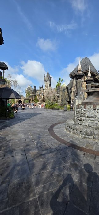 A quiet stretch of cobblestone leading toward the distant clock tower.