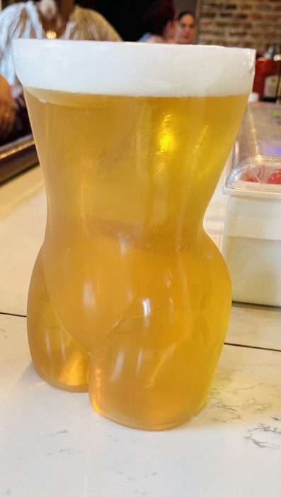 An ice-cold golden beer catches the afternoon sun.