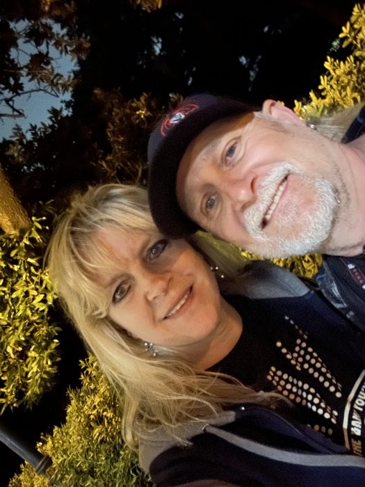 A happy couple's selfie out exploring the Savannah squares at night.