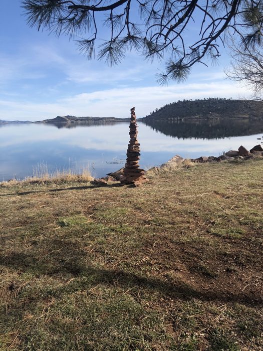 Still water and a perfect reflection on a calm Carter Lake evening.