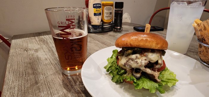 A hearty burger and a cold beer at a downtown Greenville grill.
