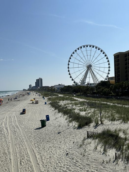 The wide sweep of Myrtle Beach with the SkyWheel arcing over the shoreline.
