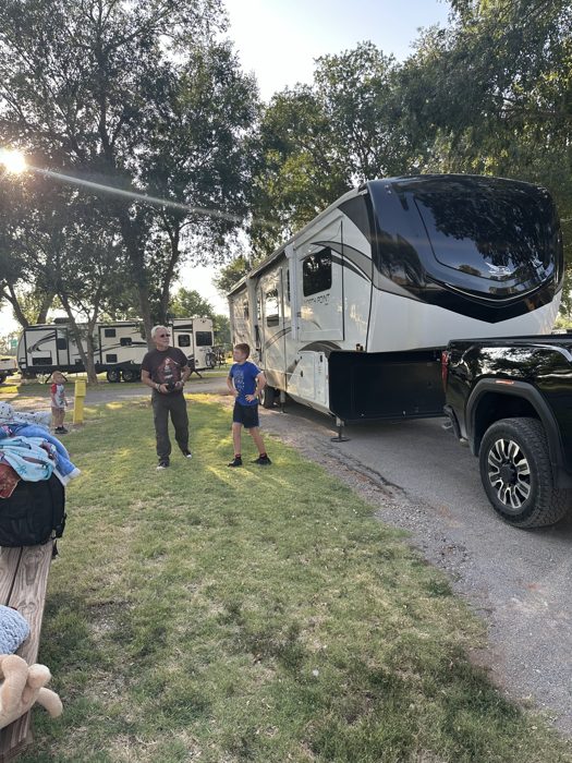 Getting the rig settled into its site as evening light filters through the trees at camp.