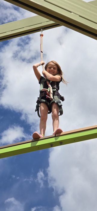 Dangling mid-element high above the course with clouds all around.
