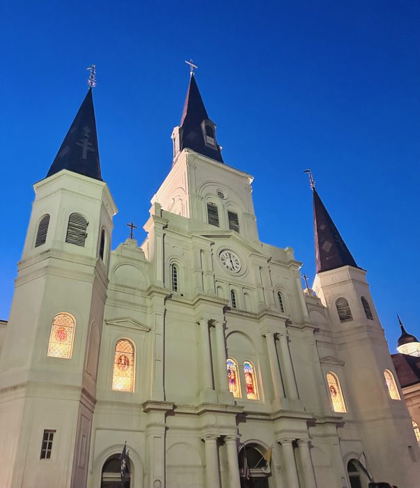 St. Louis Cathedral's white spires rise over Jackson Square.