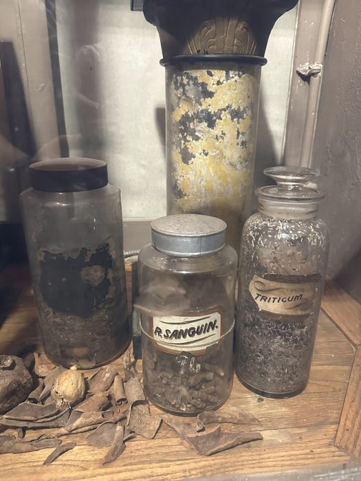 Antique apothecary jars line the shelves inside the Pharmacy Museum.