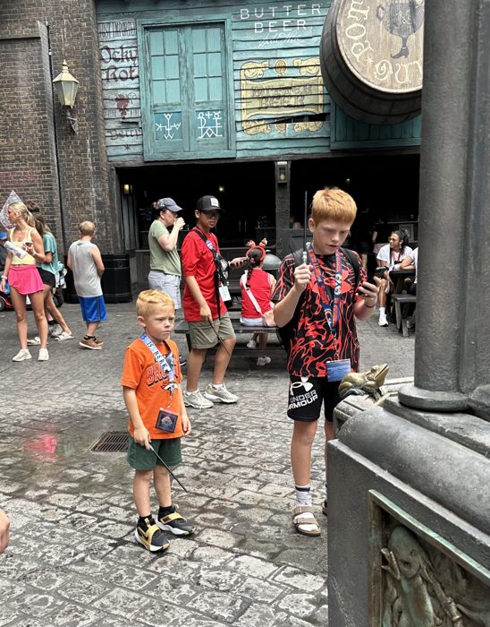 Wands ready outside the Hog's Head Pot, working out which shop window to try next.