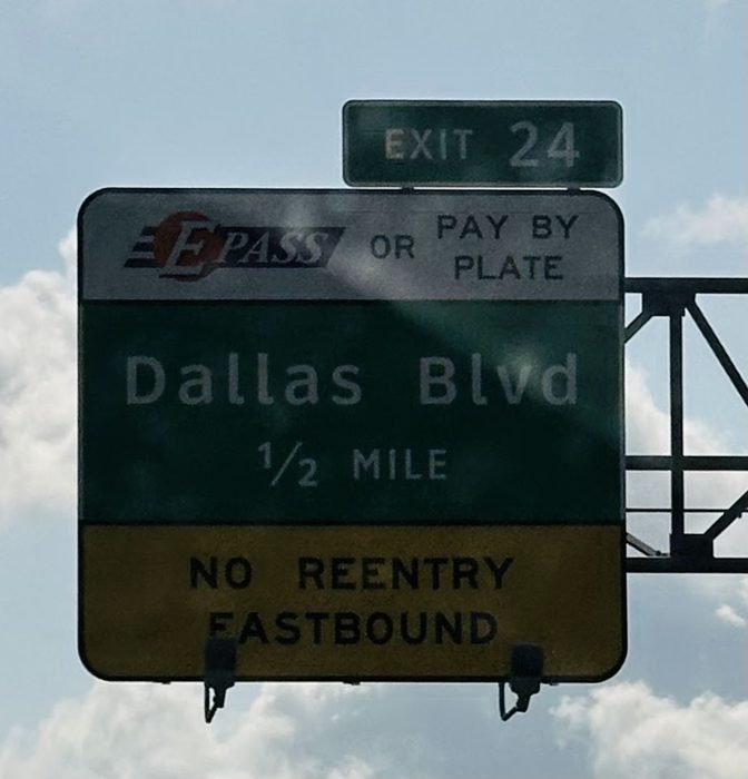 Rolling along the interstate, the exit sign counting down the miles toward the next stop.