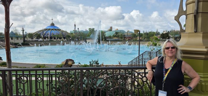 Taking in the view of the park's shimmering fountain lagoon and rooftops from the railing above.