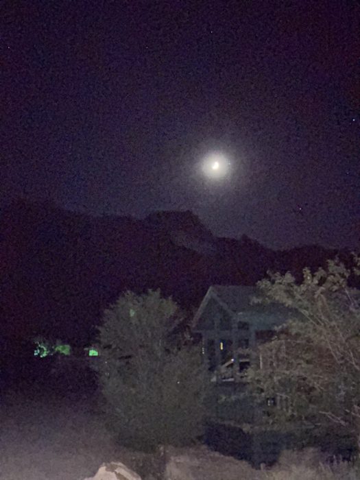 A bright moon rising over the desert at our Utah camp.