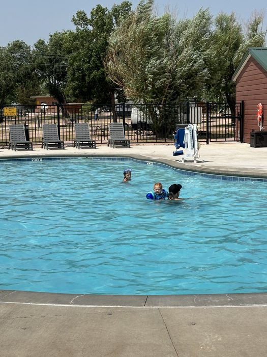 Cooling off in the campground pool after a long travel day in the Black Hills.