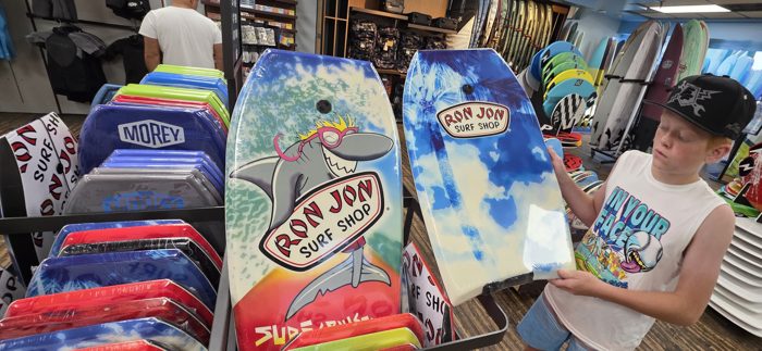Picking out a new bodyboard inside the Ron Jon Surf Shop.