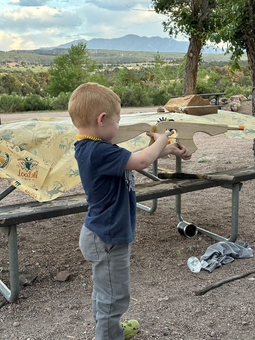 Our littlest checking out the dino-dig fossils laid out on the table.