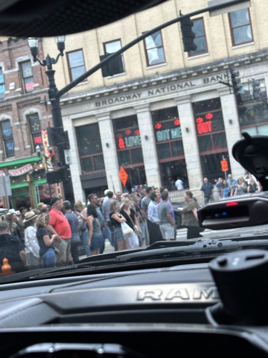 The neon and crowds of Lower Broadway, Nashville's famous honky-tonk strip.