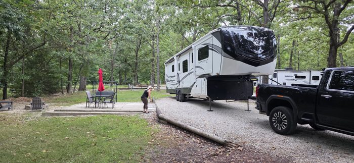 Backing the truck up to hitch onto the fifth wheel as we get ready to roll out of the wooded campsite.