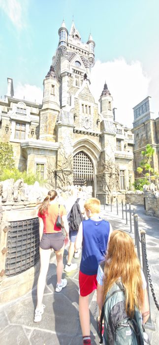 Heading toward the looming clock tower of the castle, backpacks and lanyards in tow.