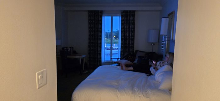 Winding down in the hotel room as dusk settles outside the window.