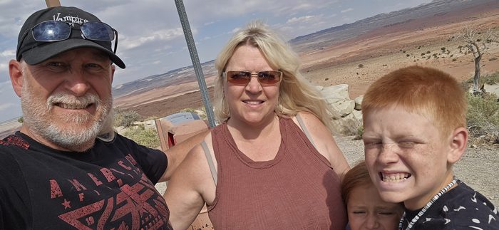 The whole family squeezed in for a selfie at a Utah desert overlook on the drive home.