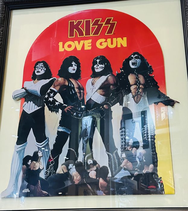 The original KISS "Love Gun" album artwork and costumes in the memorabilia case.