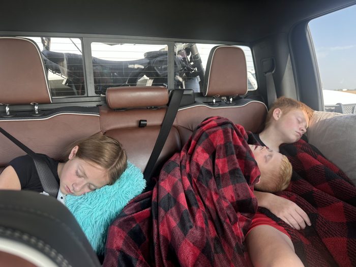 Still curled up under blankets for the ride with fields streaming past outside.