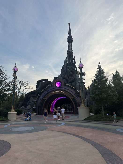 The dramatic rock archway glows purple over the 'It's Alive!' entrance as we head in for the evening.