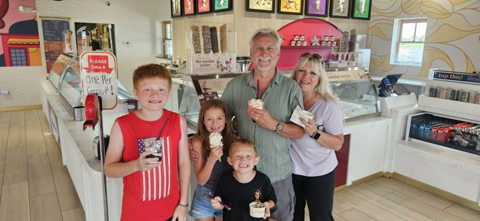 The family shows off their sundaes and cones on a stop for ice cream.