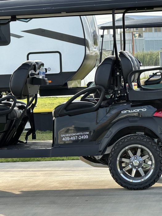 Our golf cart and rig parked up at the beachside RV park, ready to explore.