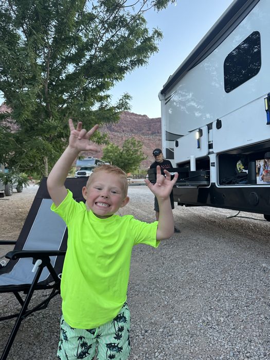 Our little guy throwing his arms up with joy as we settle into the campsite.