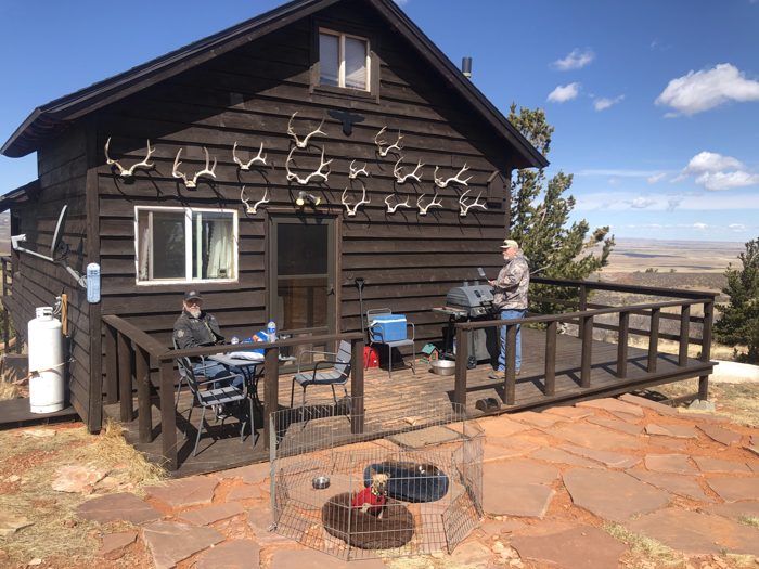 The cabin on the bluff outside Laramie, the high plains rolling out below.