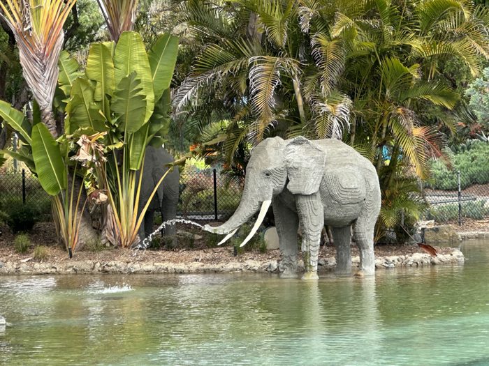 Strolling past the splashing elephant fountain at the Legoland entrance.