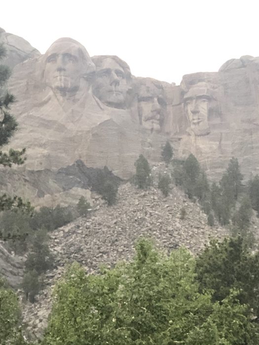 Mount Rushmore peeks through the haze on a soft, misty Black Hills afternoon.