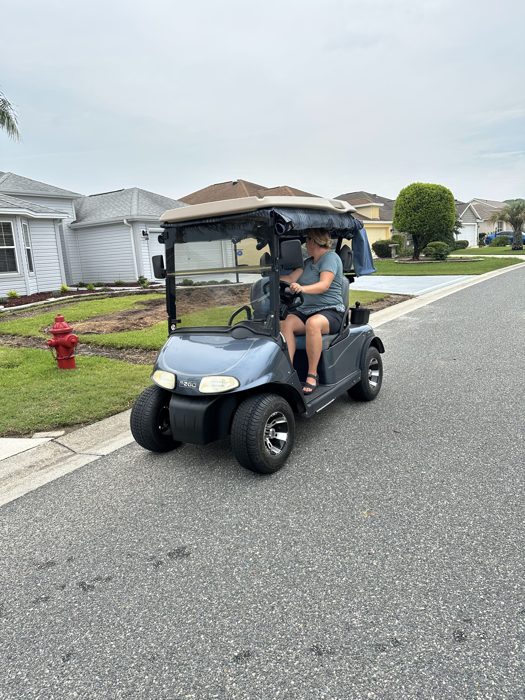 Cruising the neighborhood streets by golf cart, Florida style.