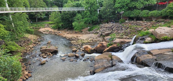 The Reedy River tumbling over its rocky falls in the heart of Greenville's Falls Park.