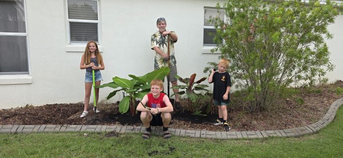The gardening crew smiles for one more shot before heading back inside.
