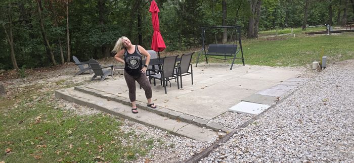 Striking a pose on the concrete patio at our shaded campsite.
