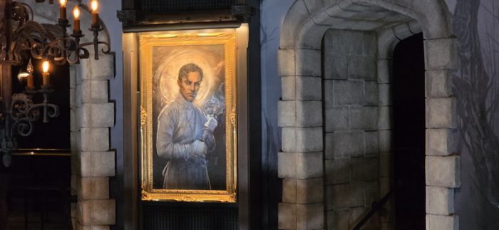 A brooding portrait of the mad scientist watching over the queue.