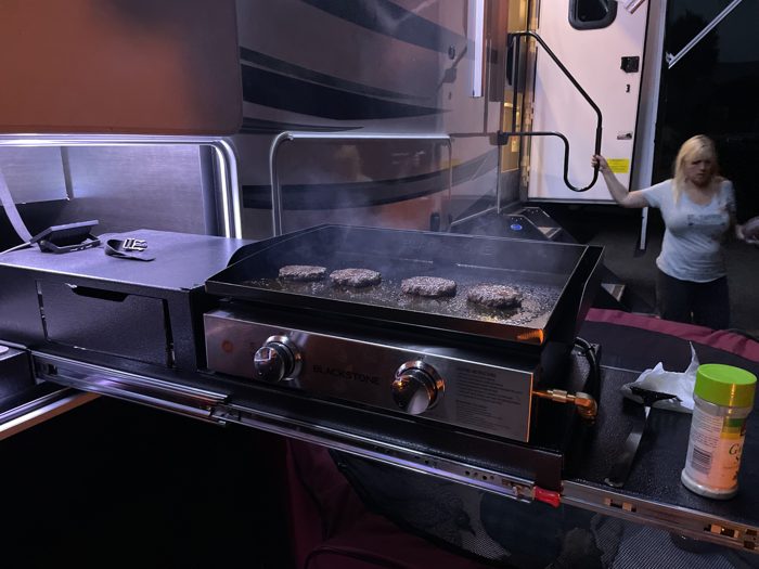 Firing up the flat-top griddle for a camp cookout at our site.