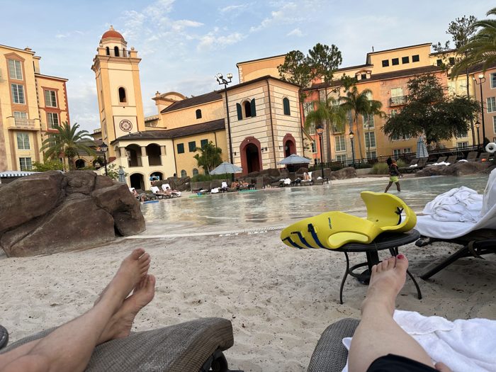 Propped up on loungers with fins drying on the table, taking in the last of the daylight by the pool.