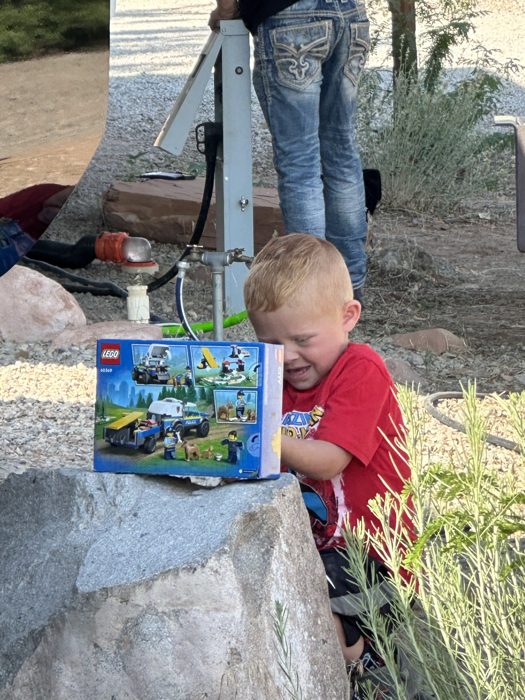 Our youngest playing with toys at the campsite while the day winds down.