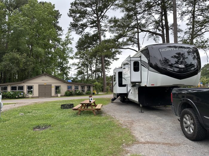 The rig parked among the pines at our wooded Charleston-area campground.