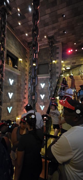 Climbing the castle stairs in our Mario Kart headsets, chains looming overhead.