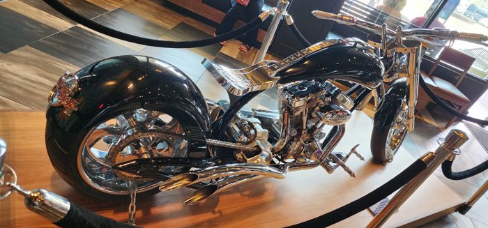 A gleaming vintage motorcycle on display among the Hard Rock memorabilia.
